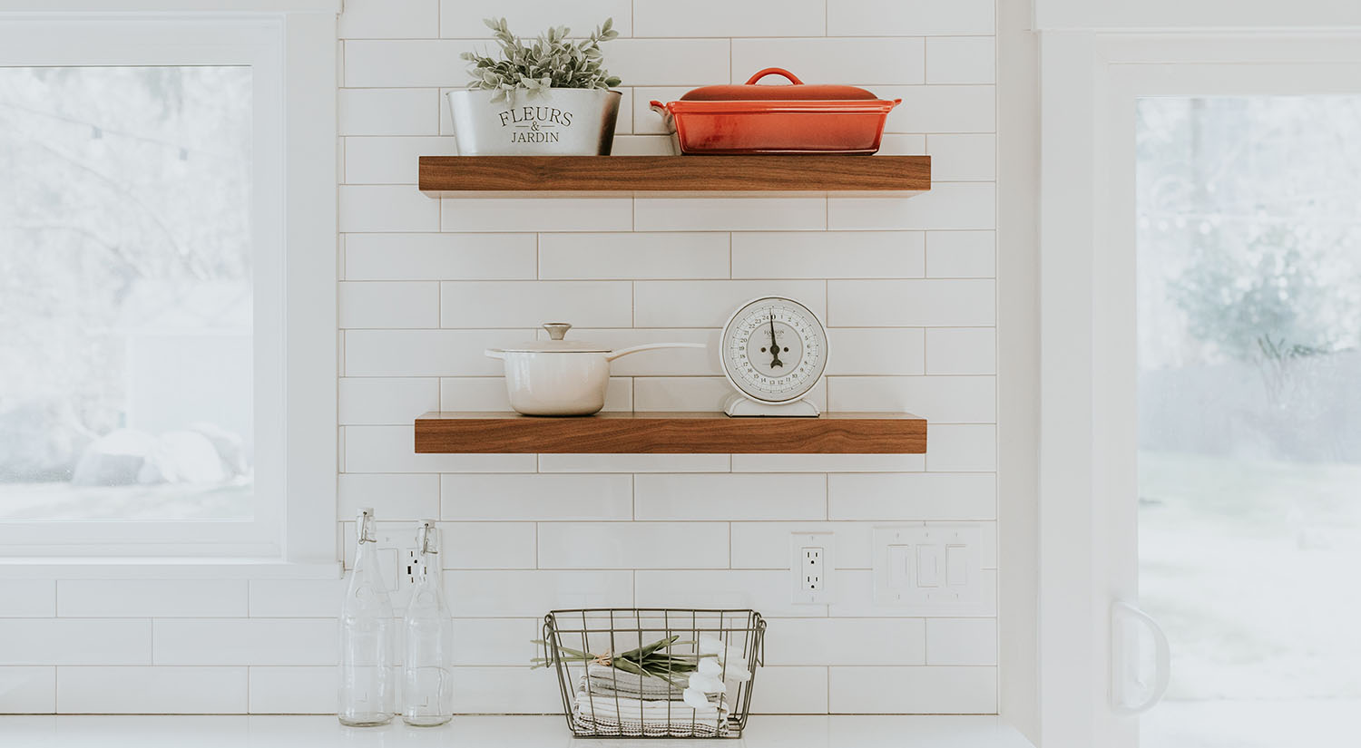 This photo of a white-tiled, spic-and-span kitchen represents a dream space for any ADHD individual. These ADHD hacks for adults can help you achieve this level of CLEAN!